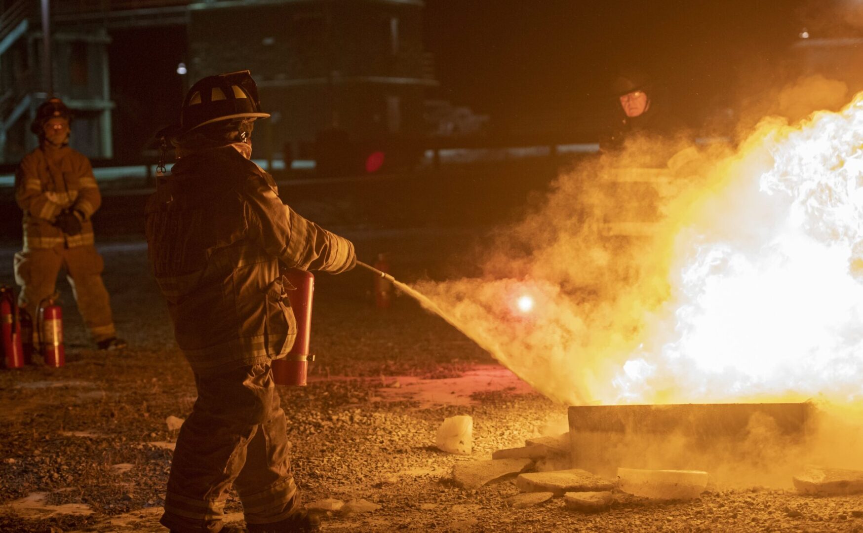 Carly Wojtaszek uses a fire extinguisher during a fire fighting training class at the Centre County Public Safety Training Center on Jan. 17, 2019.