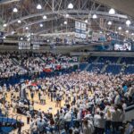 Fans storm the court at Rec Hall after Penn State's 90-89 upset of Illinois on Feb. 21. 2024.