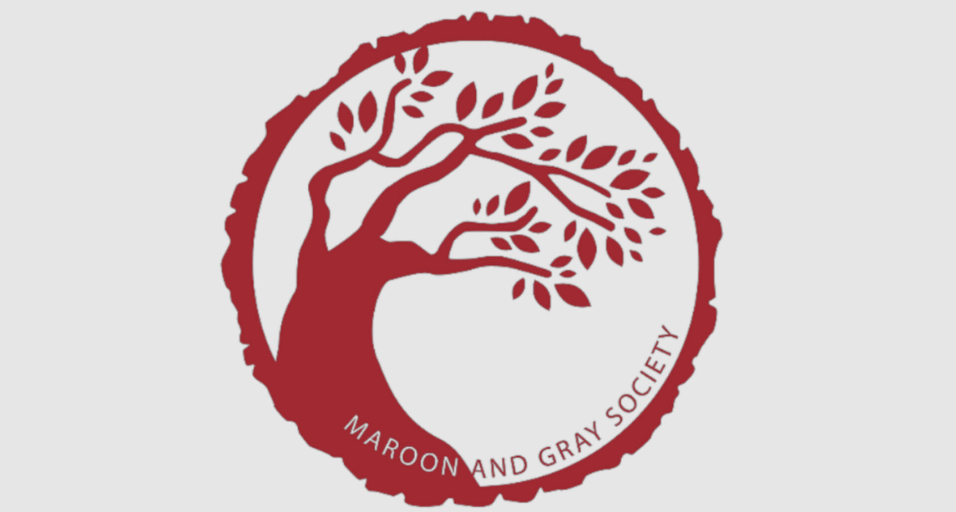 Maroon and Gray society logo in red on gray background